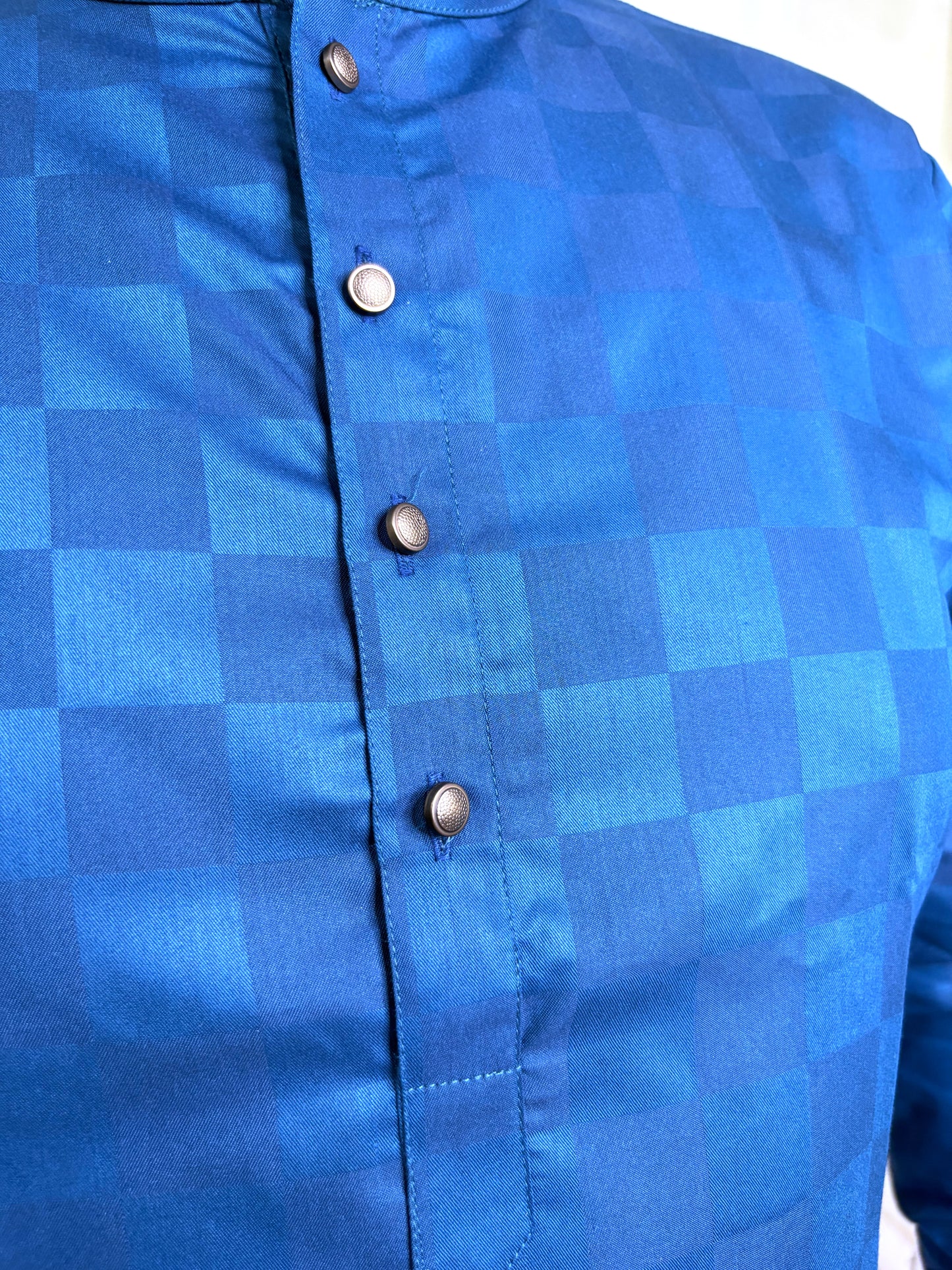 Close-up of gold-toned button placket and mandarin collar on royal blue kurta – cotton fabric
