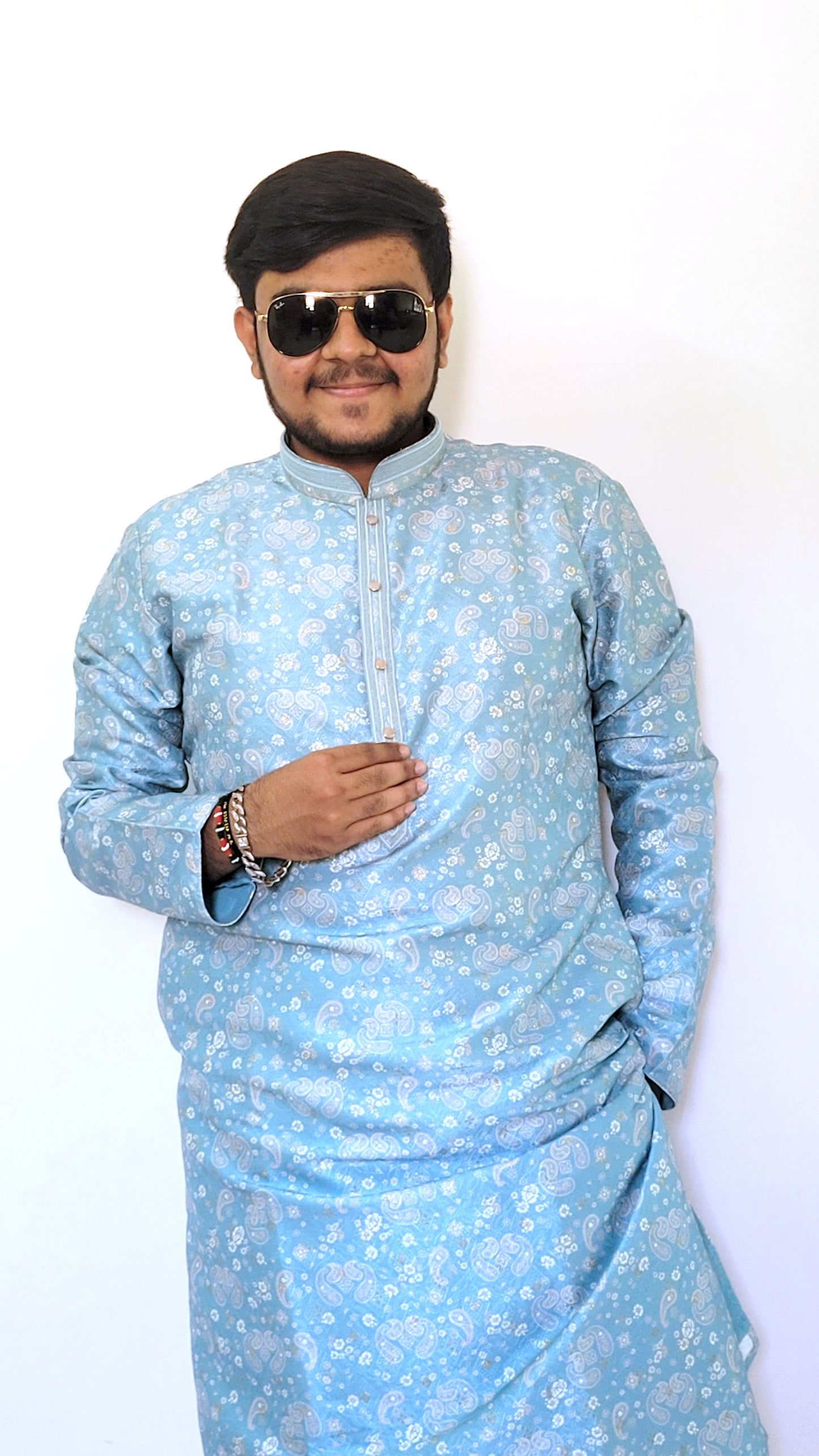 Sky blue paisley jacquard kurta styled with sunglasses – modern ethnic menswear for haldi and pooja