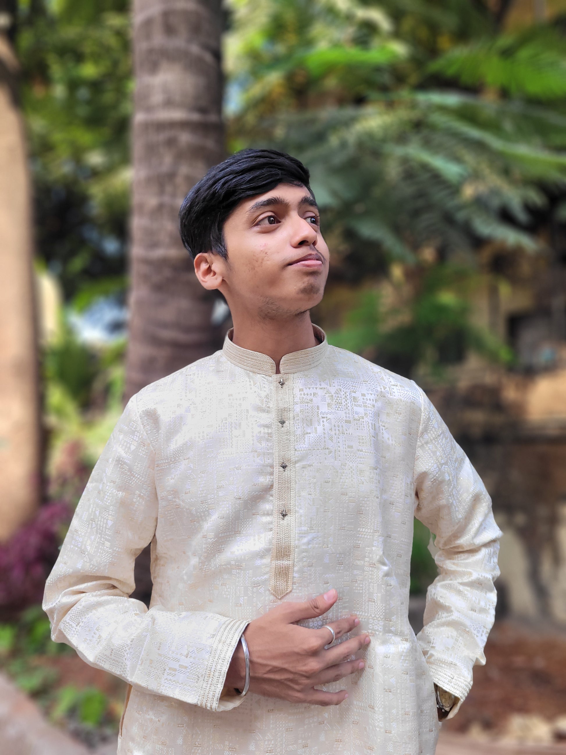 Top angle showing jacquard weave and mandarin collar on beige gold kurta – detailed ethnic menswear
