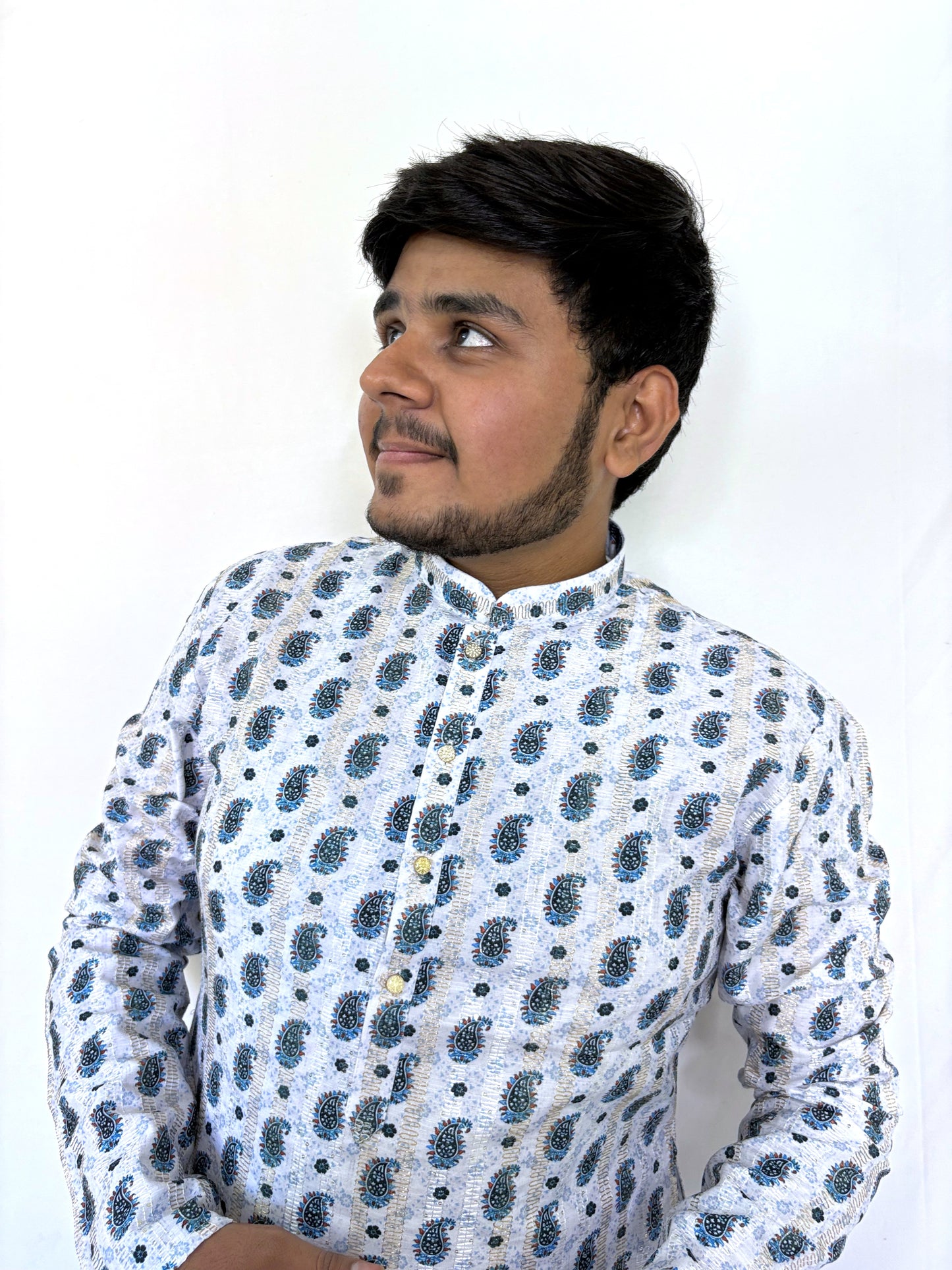Left profile of white rayon kurta with ethnic paisley motifs – lightweight festive wear for men