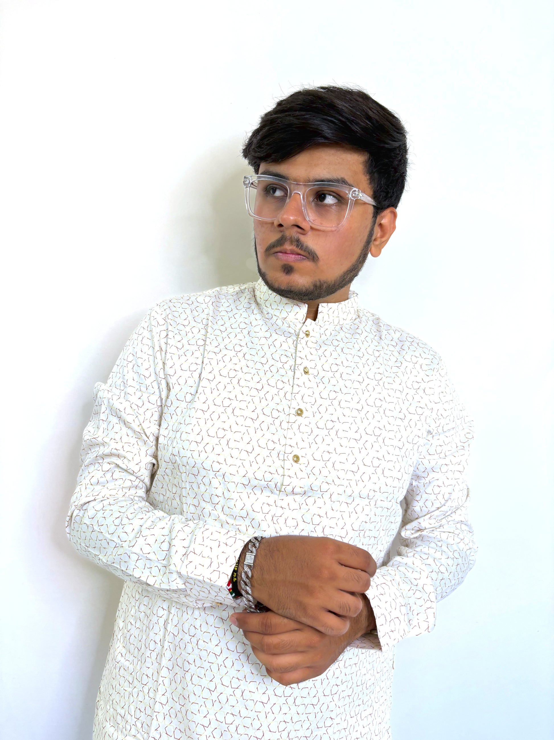 Close-up of pearl button placket and digital geometric print on cream kurta – soft Giza cotton