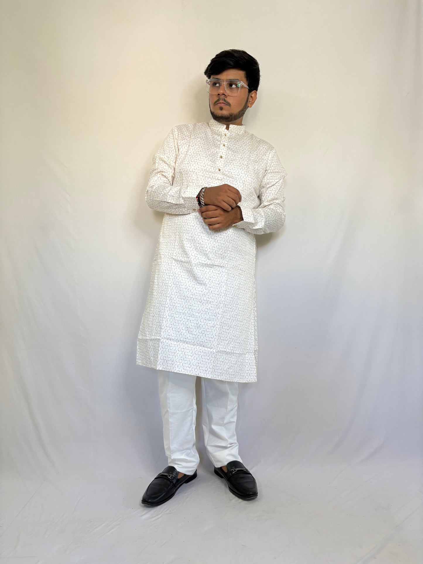 Model styling cream white kurta for pooja or haldi function – elegant ethnic menswear