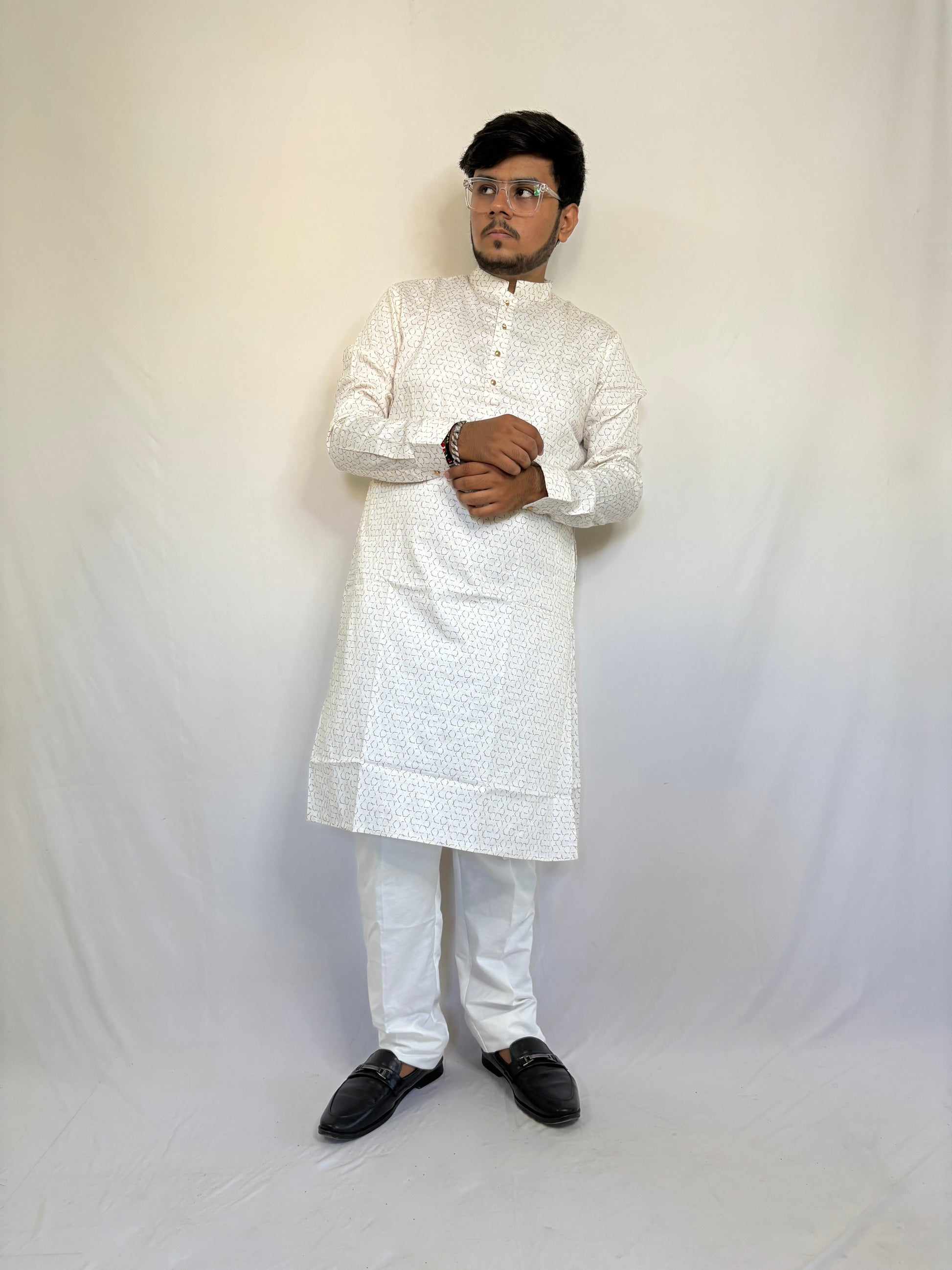 Model styling cream white kurta for pooja or haldi function – elegant ethnic menswear