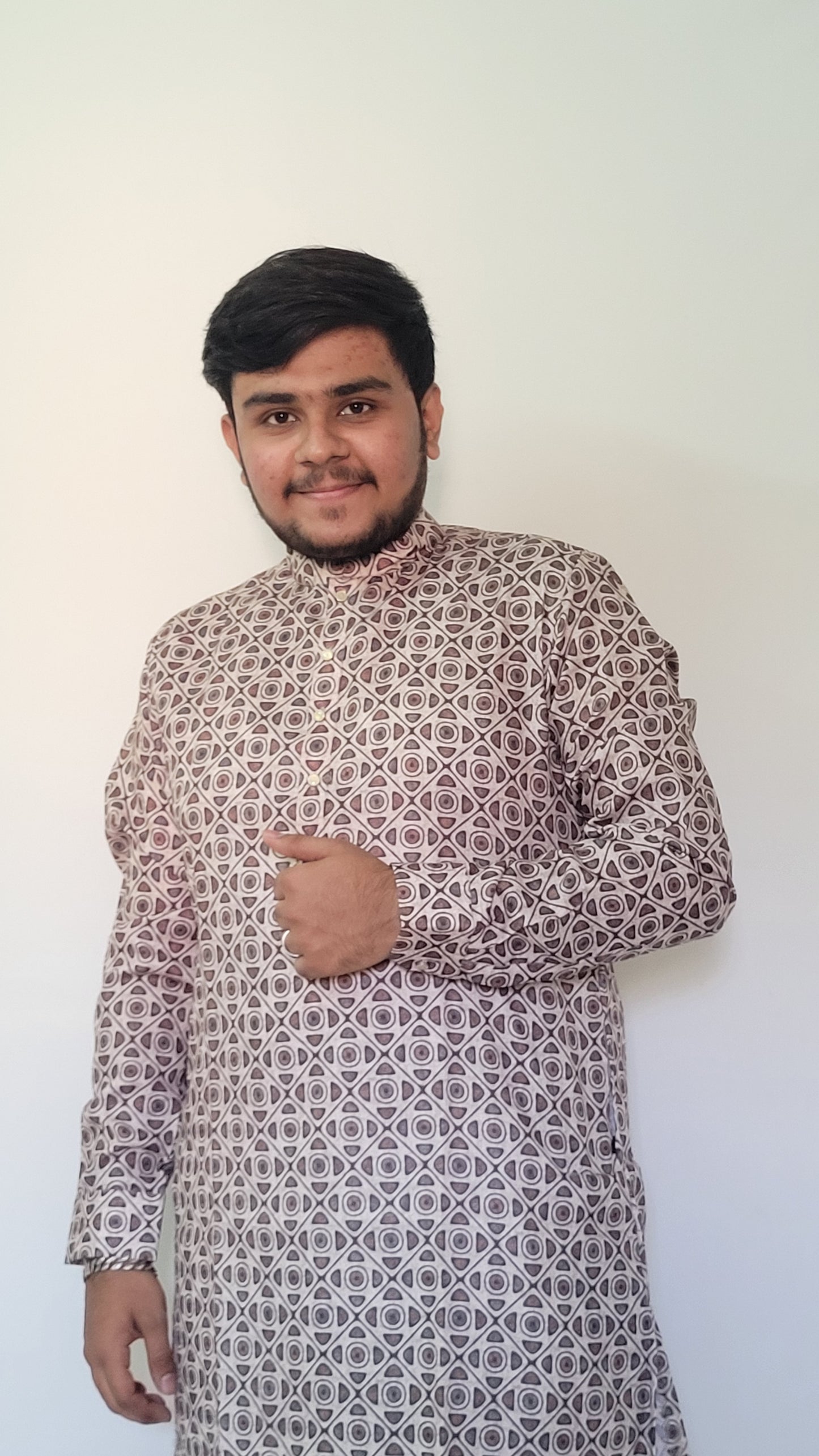 Close-up of geometric digital print on earthy cotton kurta for men – bold and breathable festive wear