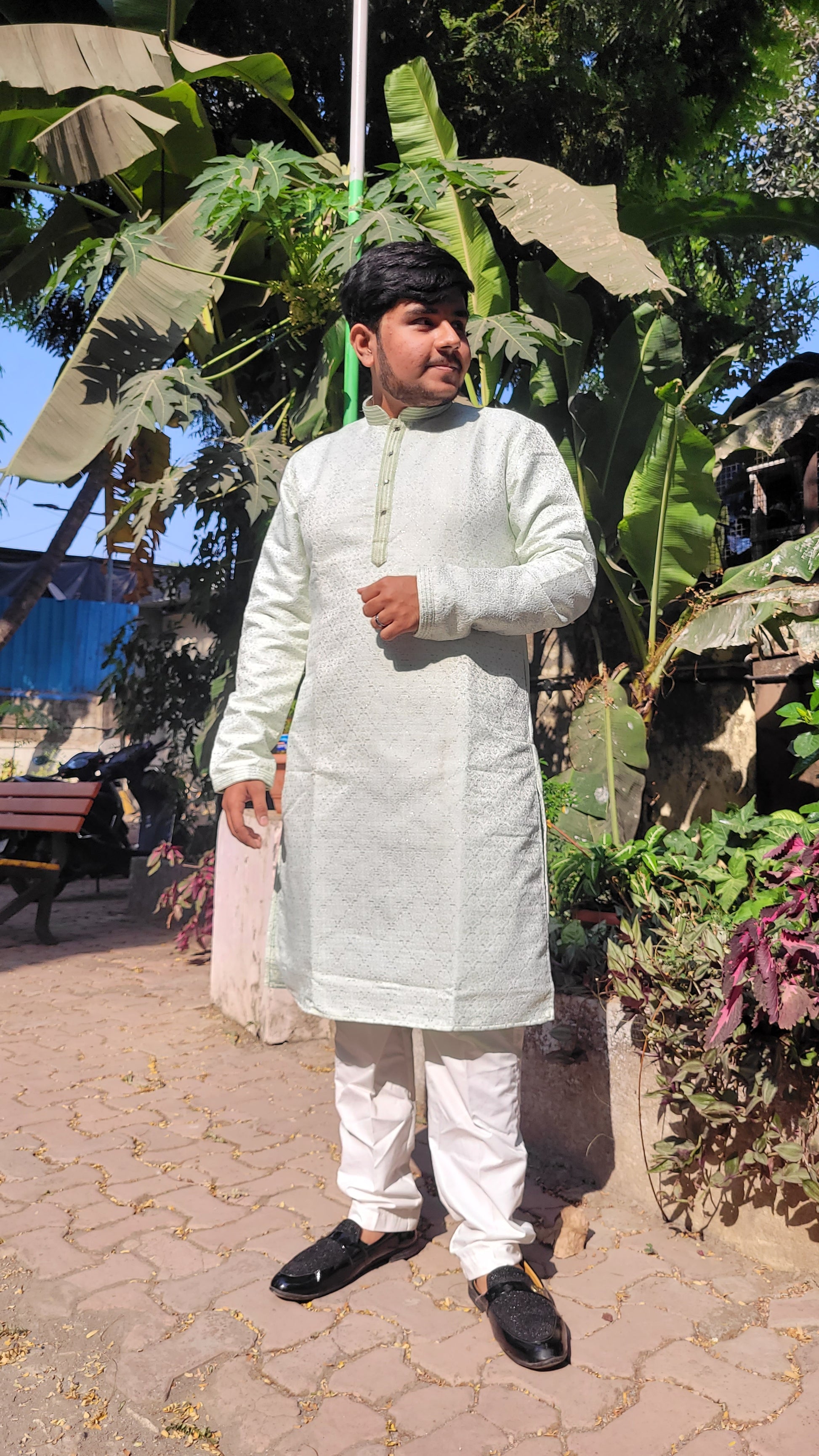 Full body left view of ivory and mint green kurta – elegant ethnic menswear with subtle jacquard shine