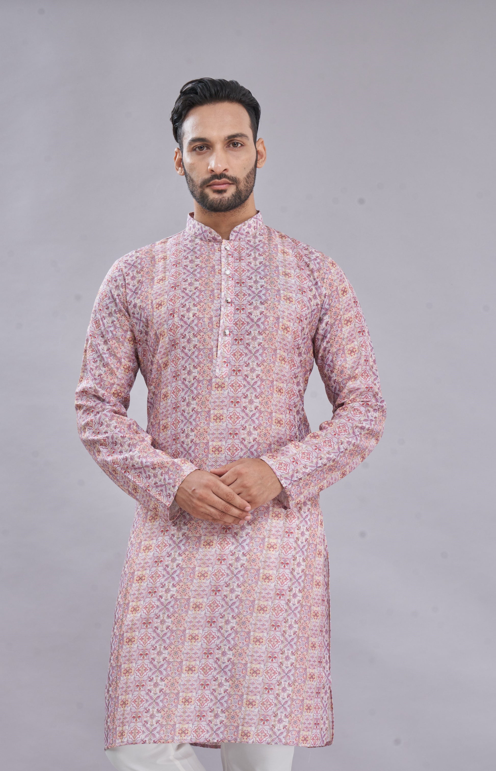 Intricate traditional print on pastel pink kurta – elegant ethnic detailing