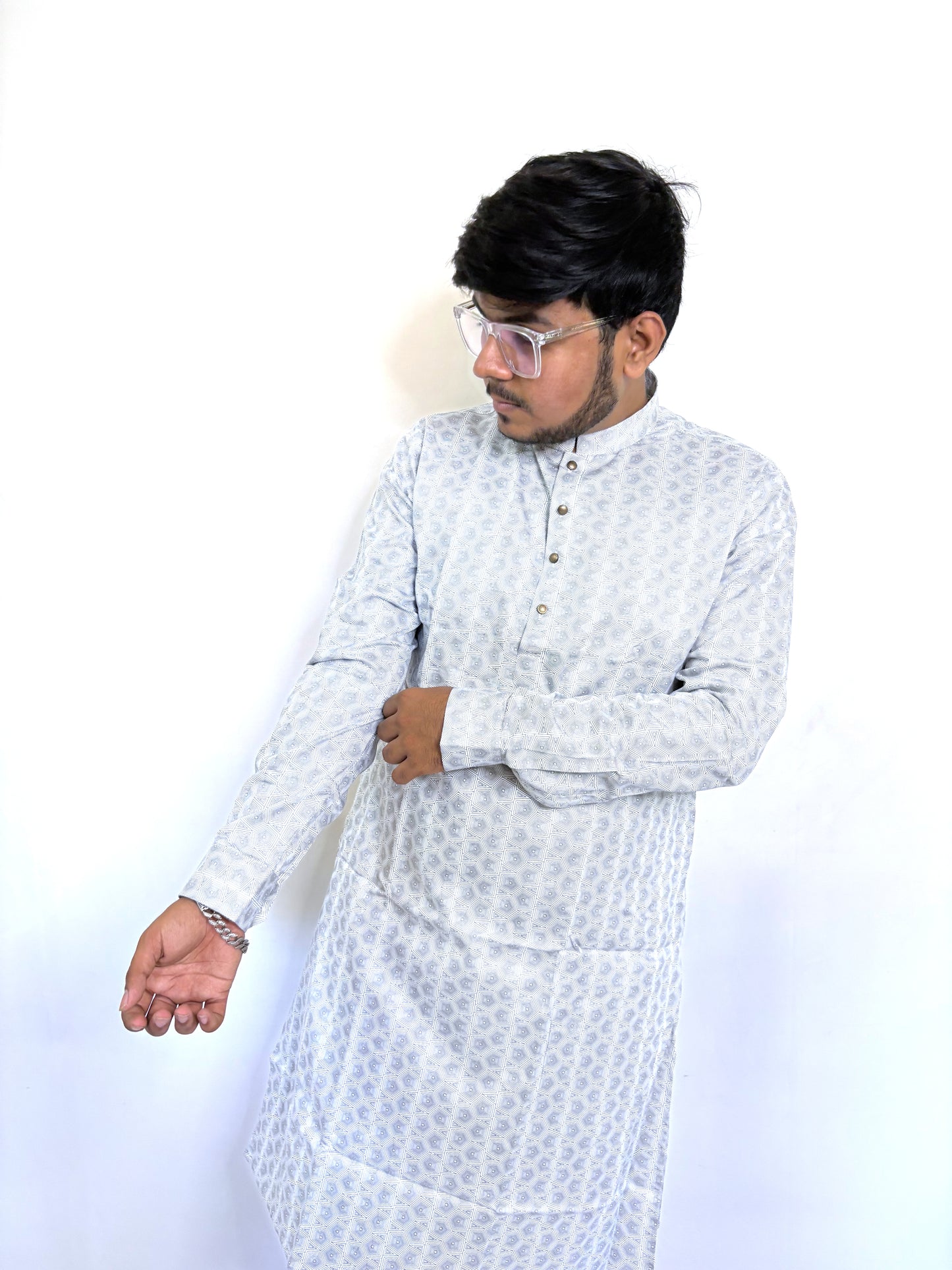 Close-up of digital geometric pattern and bronze buttons on monochrome kurta – breathable cotton fabric