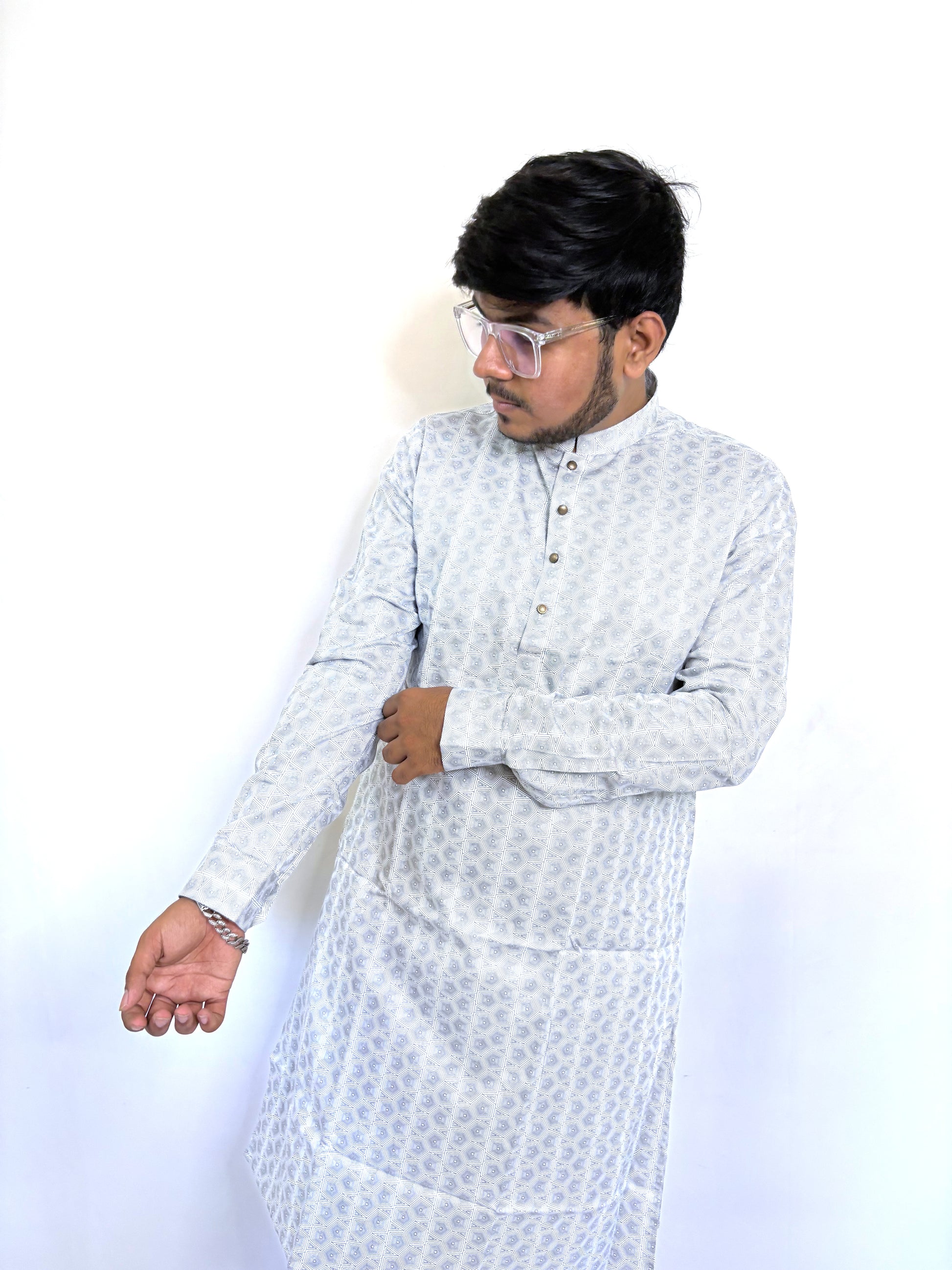 Close-up of digital geometric pattern and bronze buttons on monochrome kurta – breathable cotton fabric