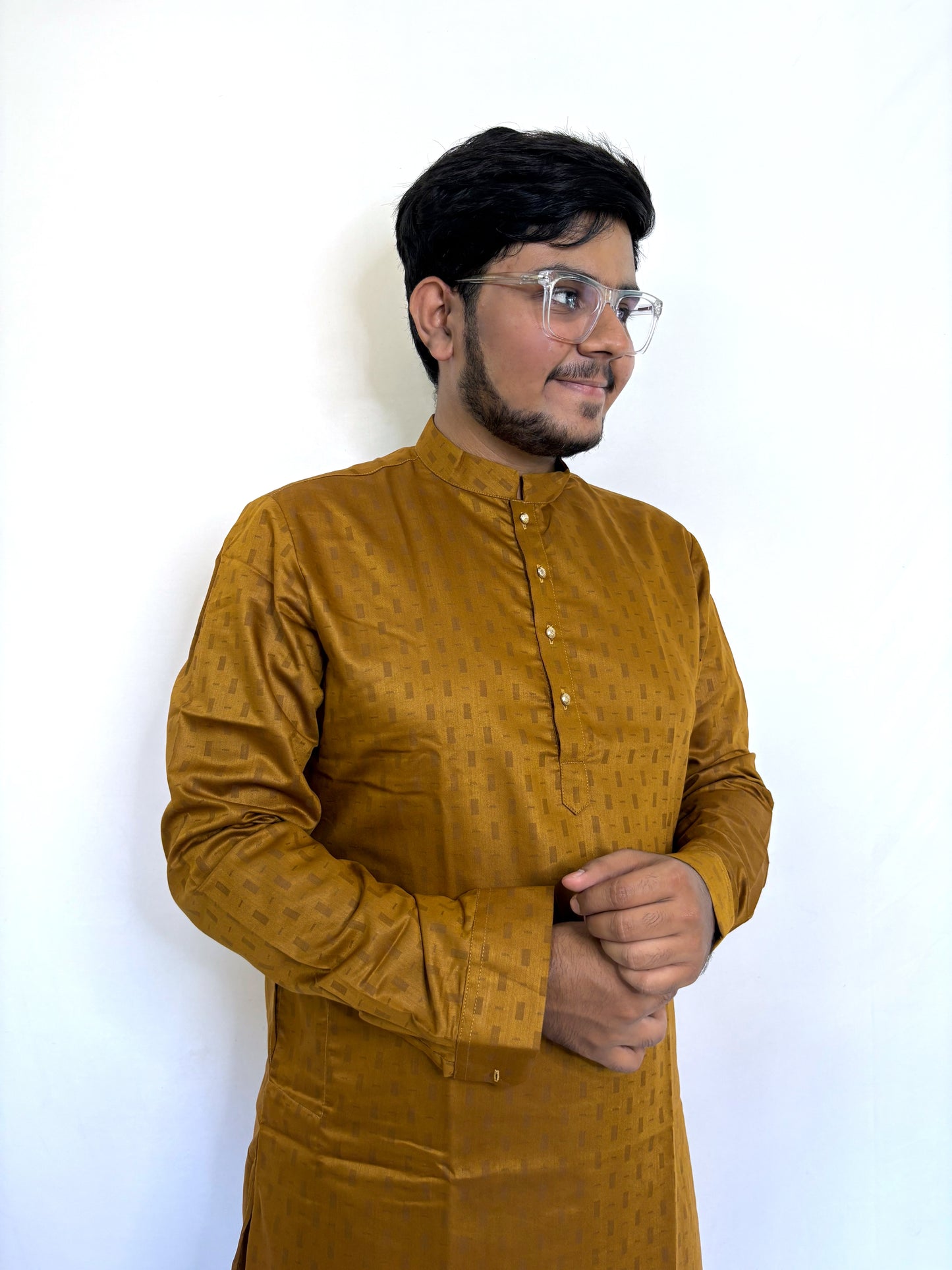 Close-up of gold-toned buttons and mandarin neck on mustard self-woven kurta – cotton fabric