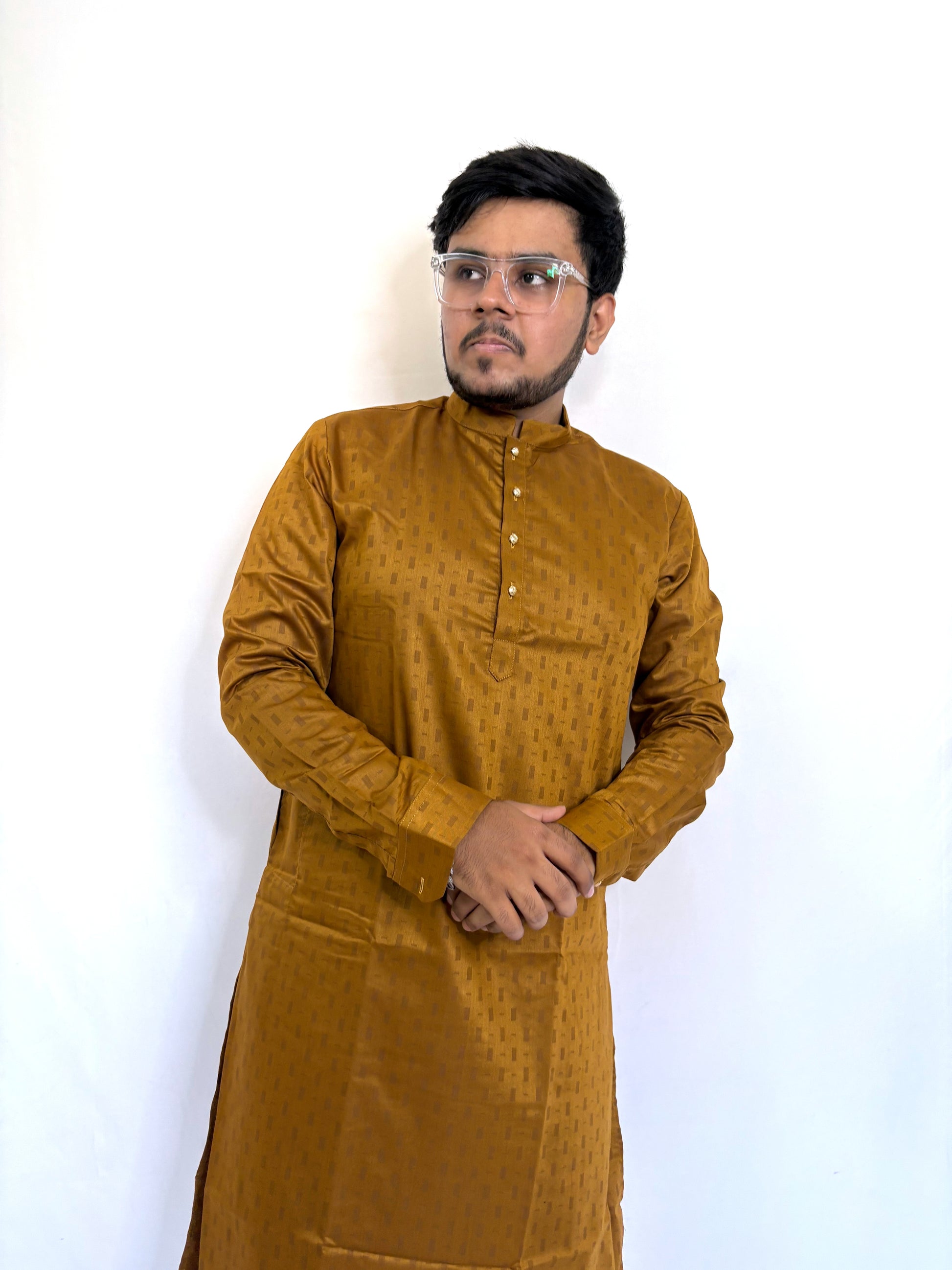 Detailed texture of self-woven pattern on mustard cotton kurta – traditional fabric finish