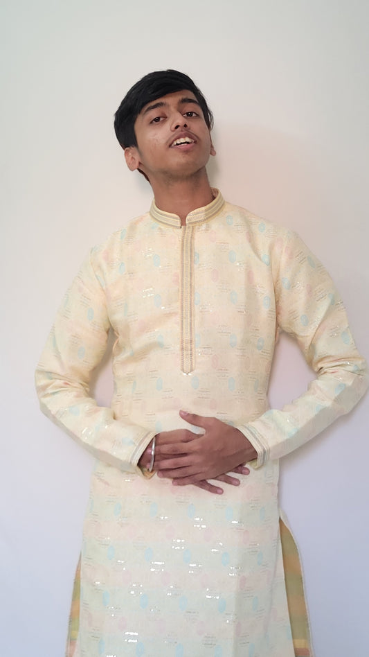 Half-body front view of cream jacquard kurta with pastel motifs – subtle glam ethnic wear