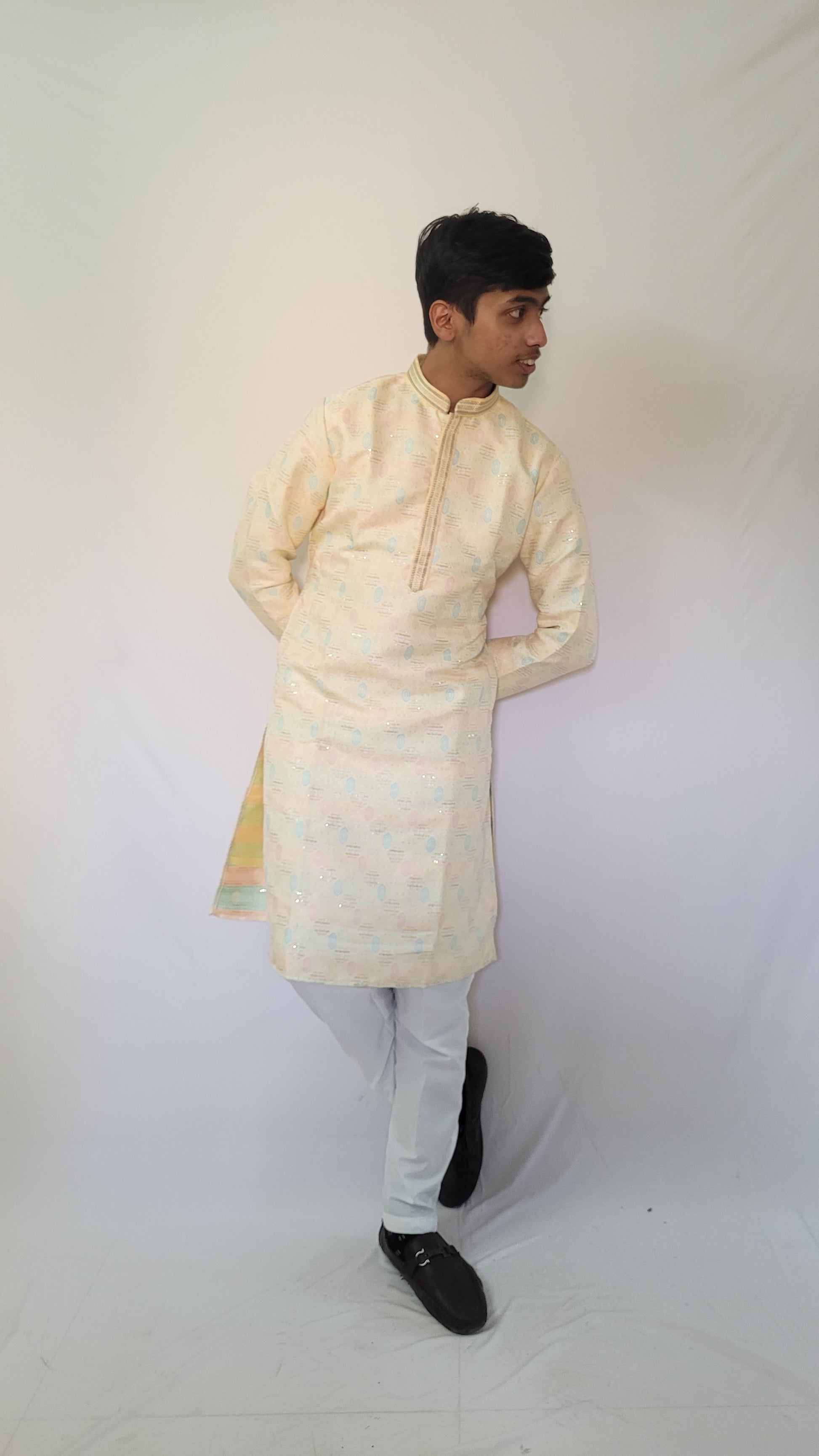 Full body left angle of men’s pastel jacquard kurta – festive ethnic outfit with soft blue and pink details