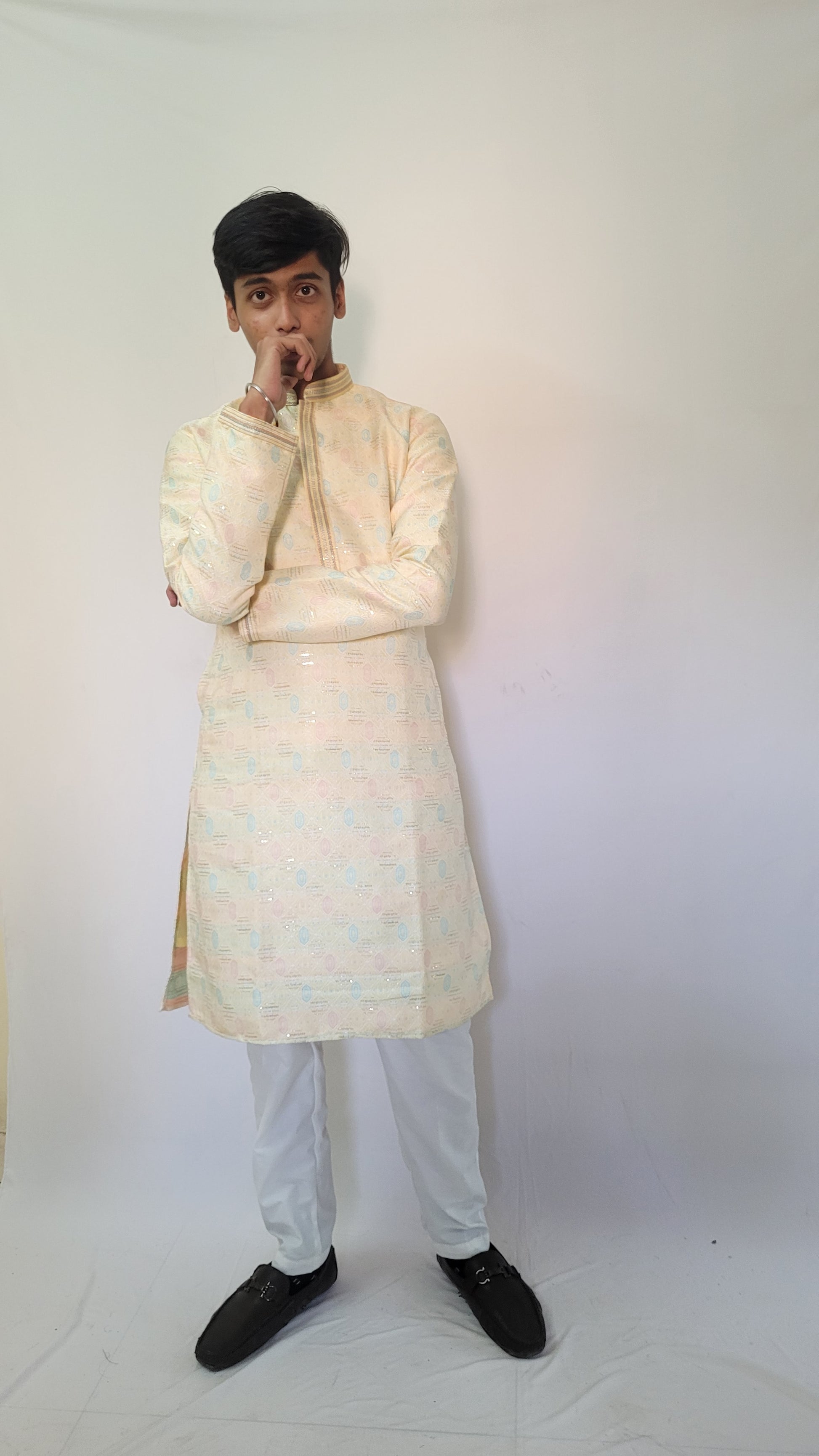 Front standing view of pastel jacquard kurta for men – cream ethnic wear with shimmer and comfort fit