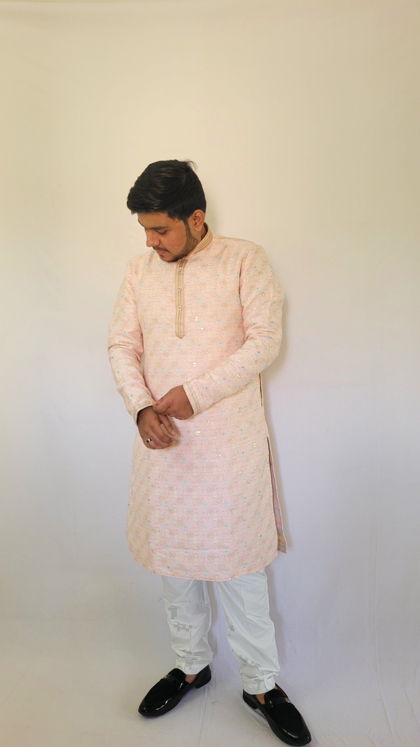Left angle full body view of light pink pastel kurta with golden jacquard weave – modern ethnic outfit for mehendi or reception