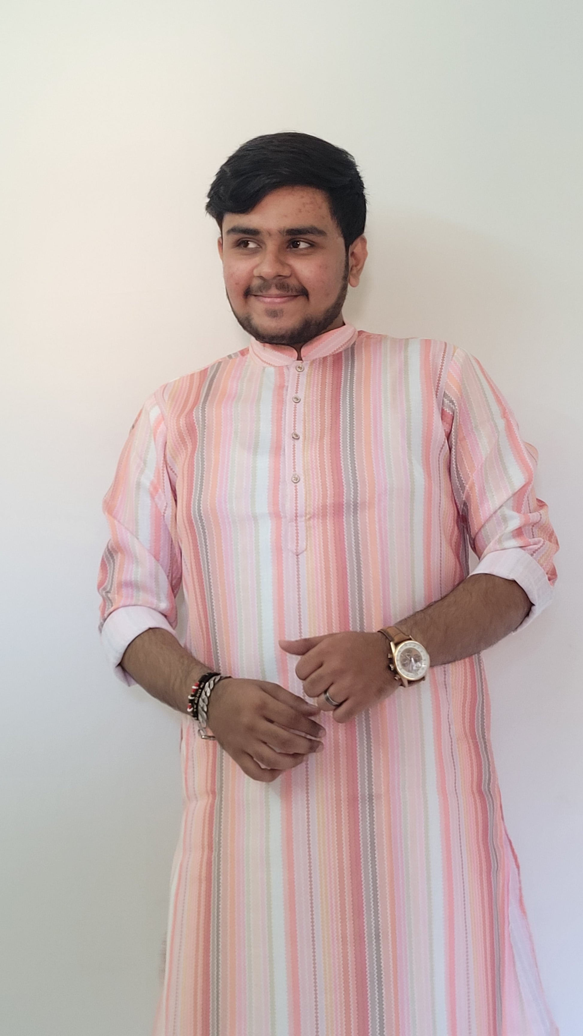 Half-body standing view of pastel striped cotton kurta for men – summer-ready ethnic outfit