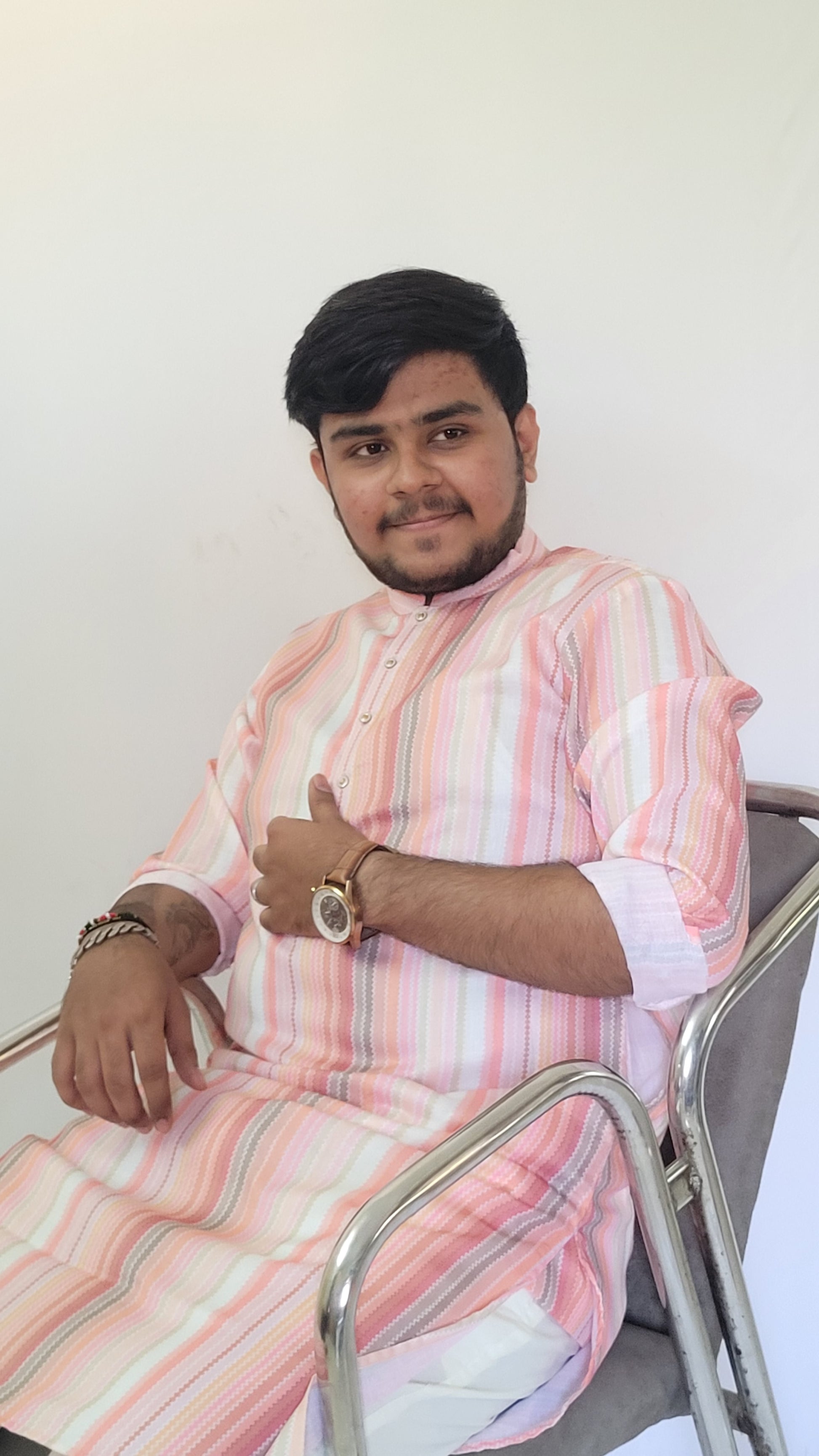 Front seated view of men’s pastel stripe cotton kurta – light ethnic outfit for casual poojas and brunch