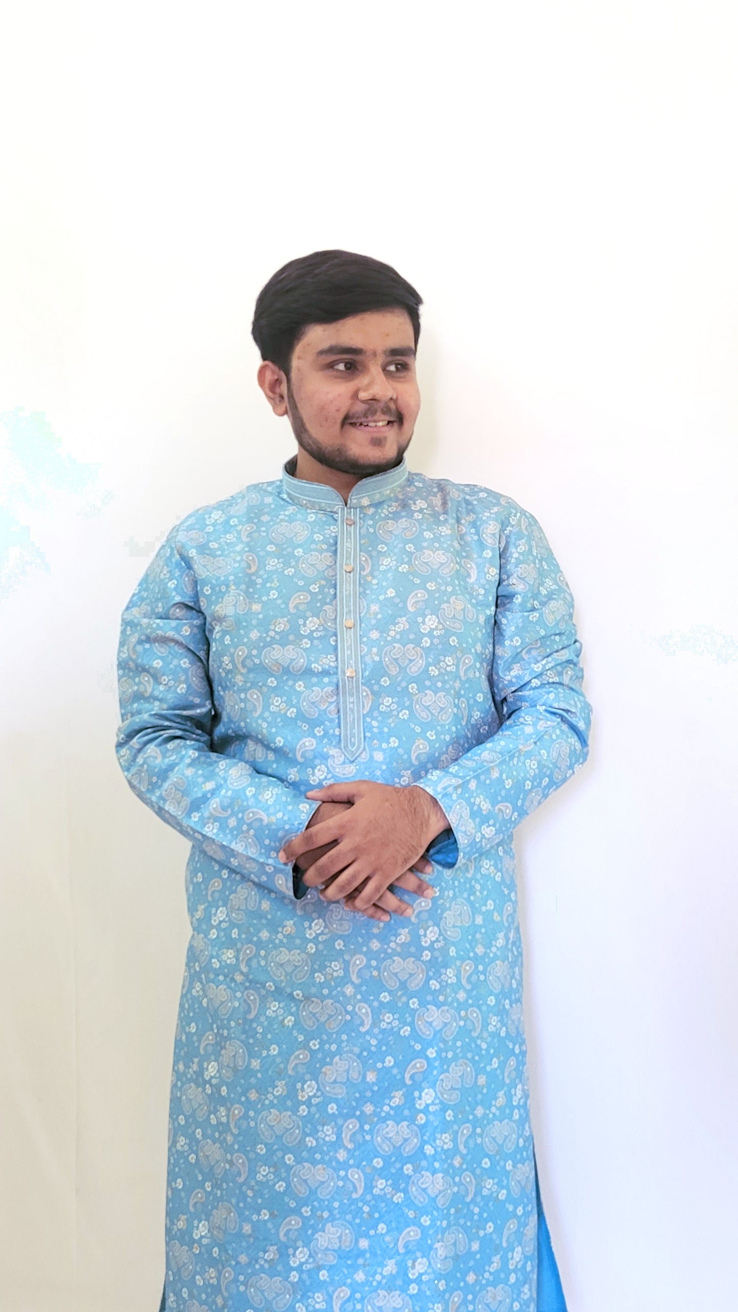 Side-left profile of men’s sky blue jacquard kurta – traditional paisley print in pastel tones