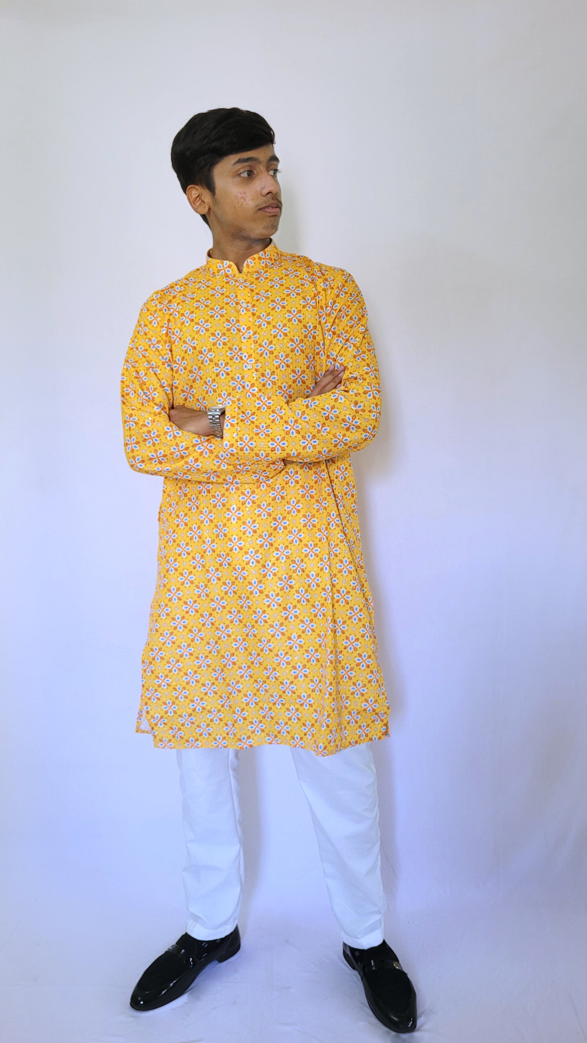 Left side profile of men’s bright yellow kurta with multicolor floral print – perfect for pre-wedding ceremonies